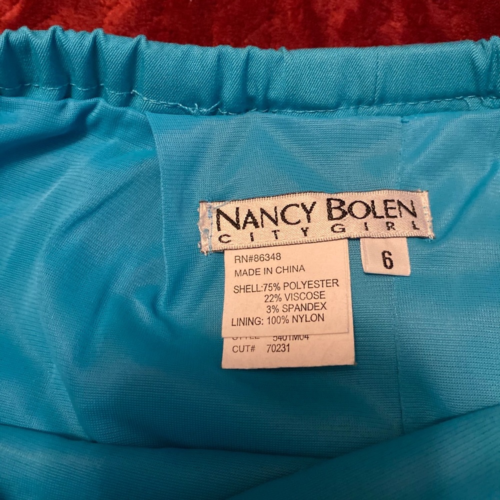 Like new straight mid calve blue/green skirt with zipper closure size 6.